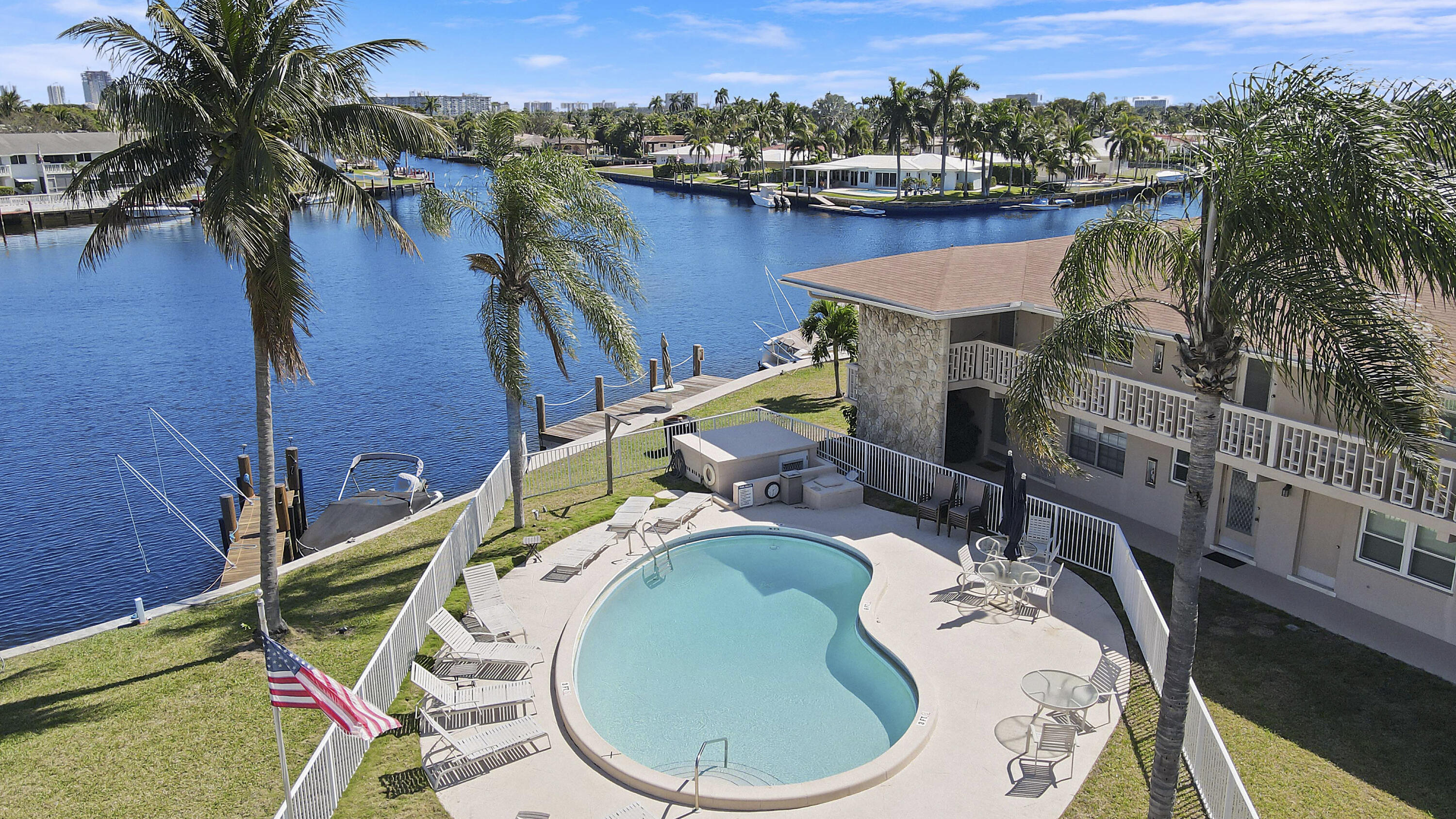 298 Southeast 6th Avenue, Unit 6 Pompano Beach, FL 33060 - Photo 32 of 36 an aerial view of a house with swimming pool outdoor seating and mountain view