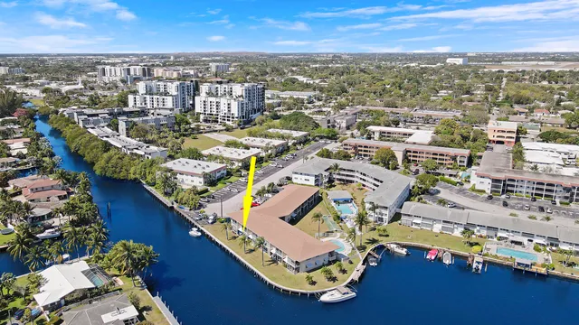 an aerial view of a city with ocean view