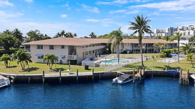 a view of a swimming pool and lounge chairs