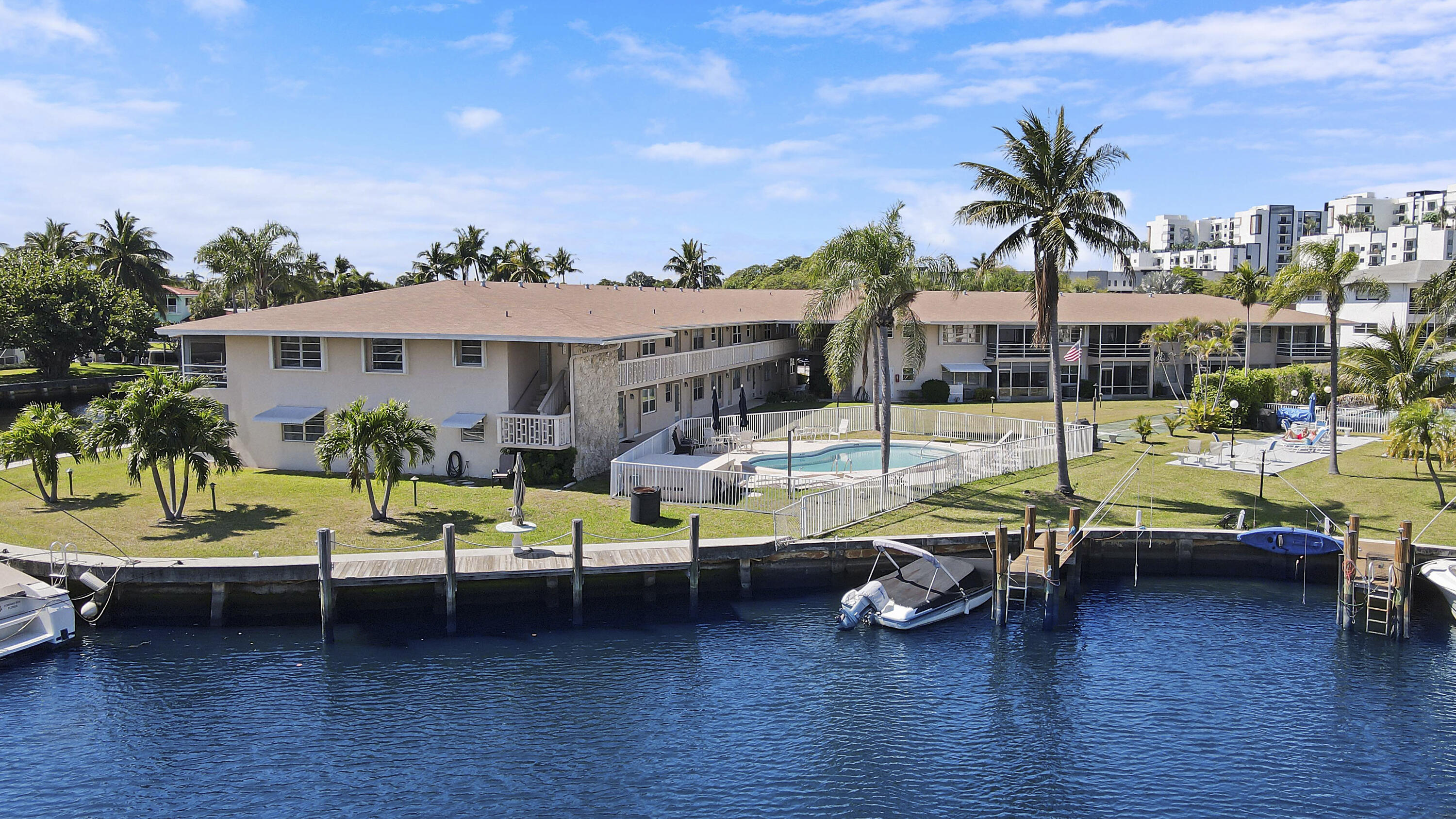 298 Southeast 6th Avenue, Unit 6 Pompano Beach, FL 33060 - Photo 35 of 36 a view of a swimming pool and lounge chairs