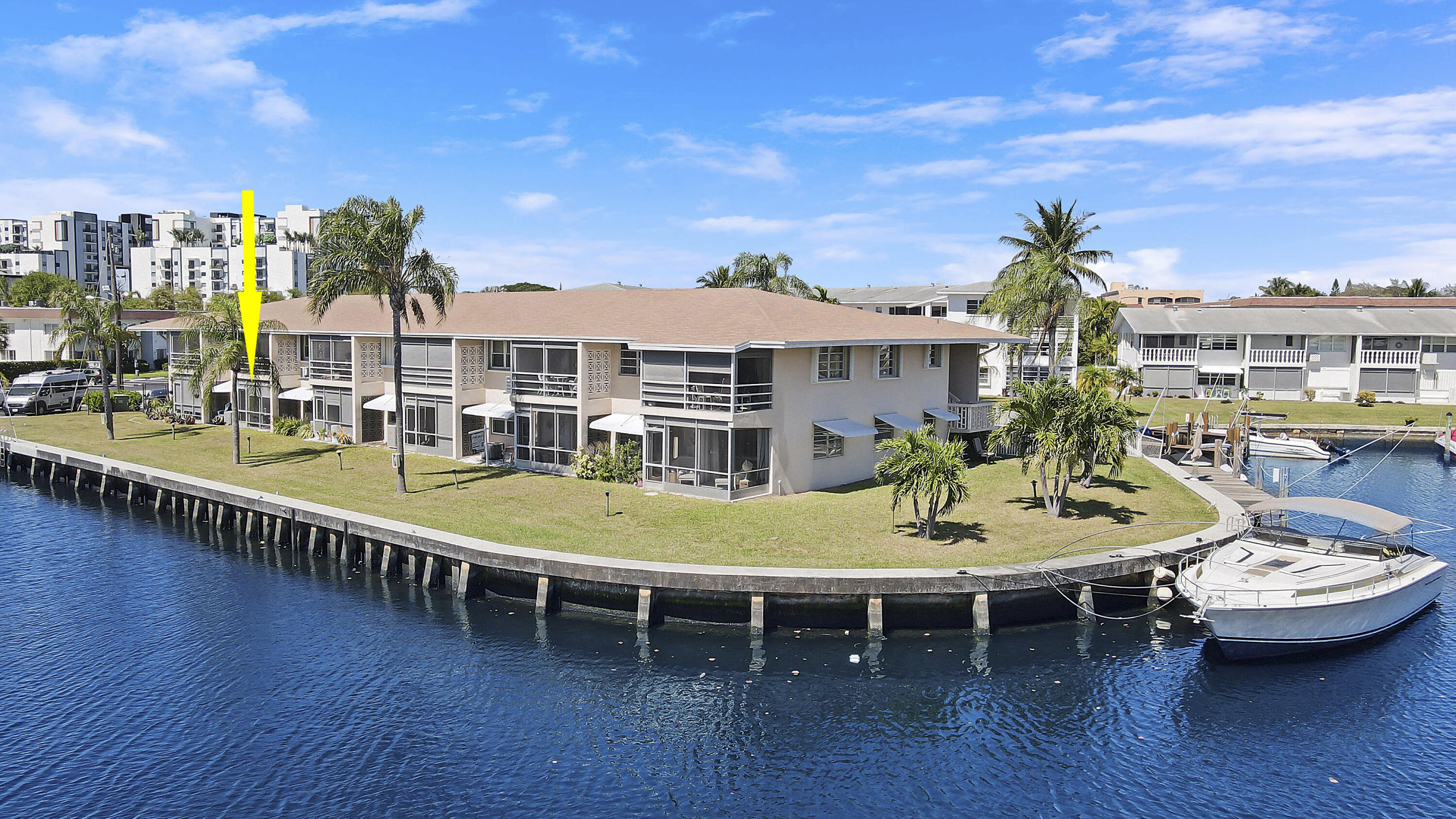 298 Southeast 6th Avenue, Unit 6 Pompano Beach, FL 33060 - Photo 4 of 36 a view of a patio with table and chairs with wooden floor and fence
