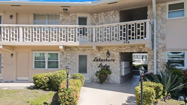 front view of a house with a potted plant