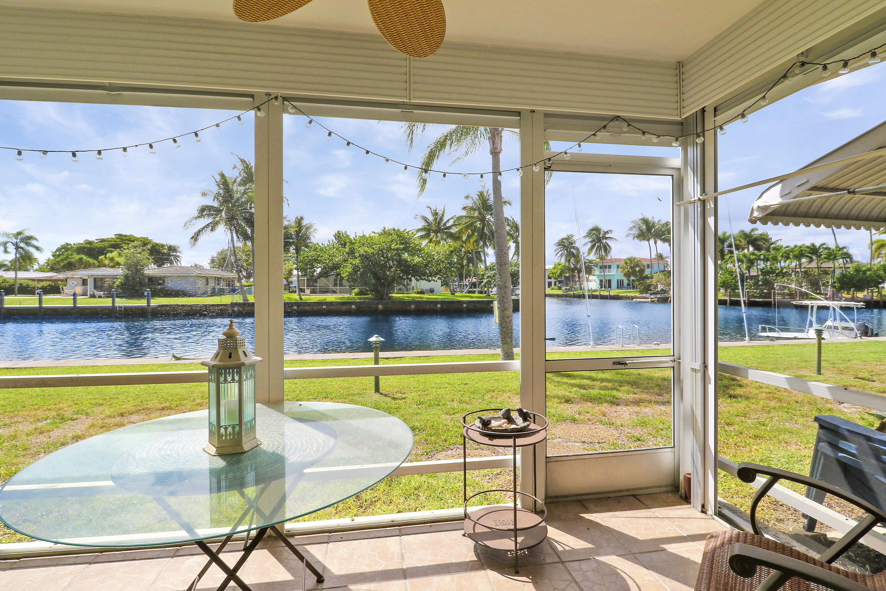 298 Southeast 6th Avenue, Unit 6 Pompano Beach, FL 33060 - Photo 6 of 36 a view of a swimming pool with a table and chairs