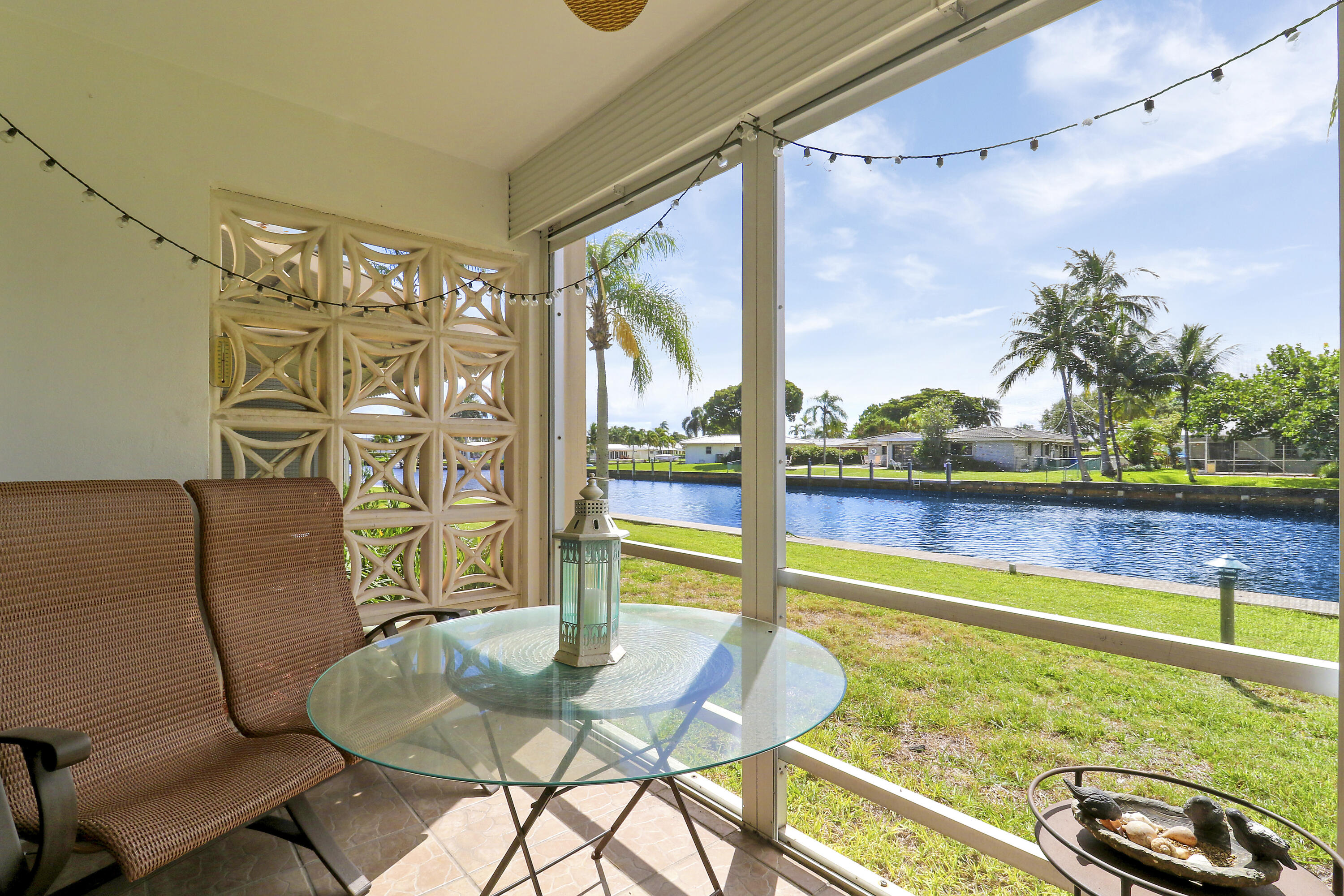 298 Southeast 6th Avenue, Unit 6 Pompano Beach, FL 33060 - Photo 7 of 36 a room with furniture and a floor to ceiling window