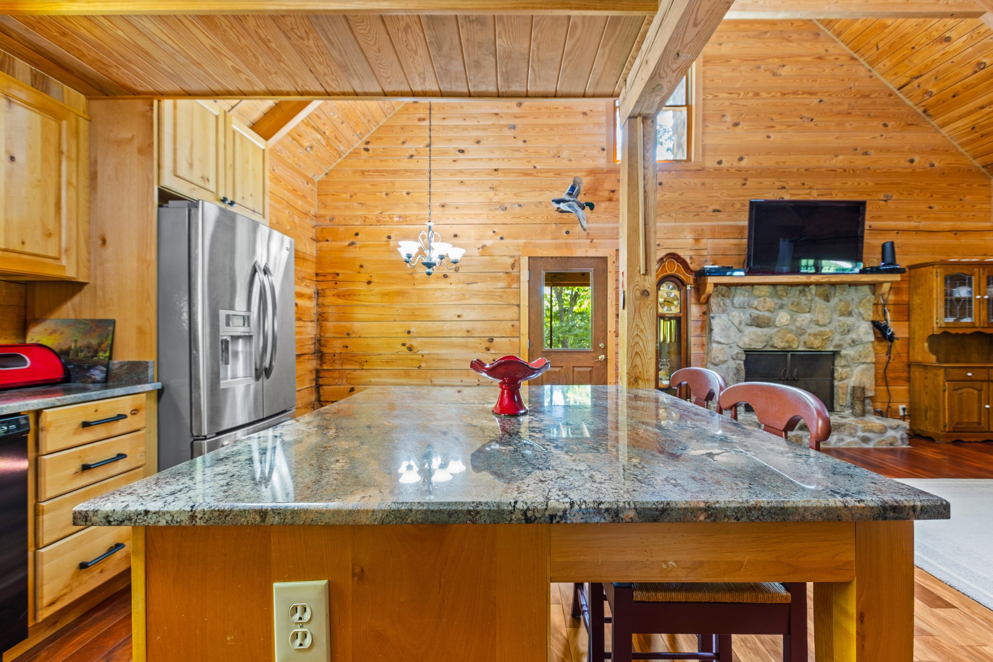 6435 Davis Hill Road Birchwood, TN 37308 - Photo 19 of 64 a kitchen with kitchen island granite countertop a sink and a refrigerator