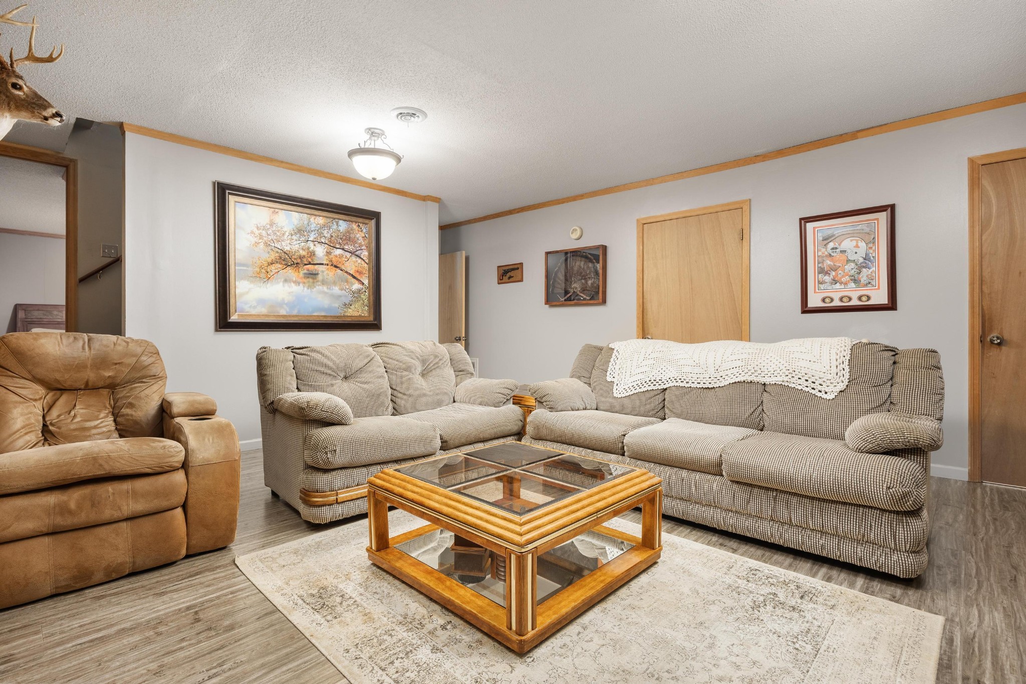 6435 Davis Hill Road Birchwood, TN 37308 - Photo 35 of 64 a living room with furniture a couch and paintings on the wall
