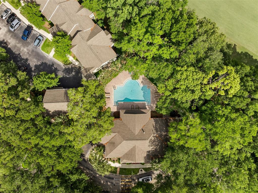 10000 Southwest 52nd Avenue, Unit 35 Gainesville, FL 32608 - Photo 2 of 36 an aerial view of a house with a yard and garden