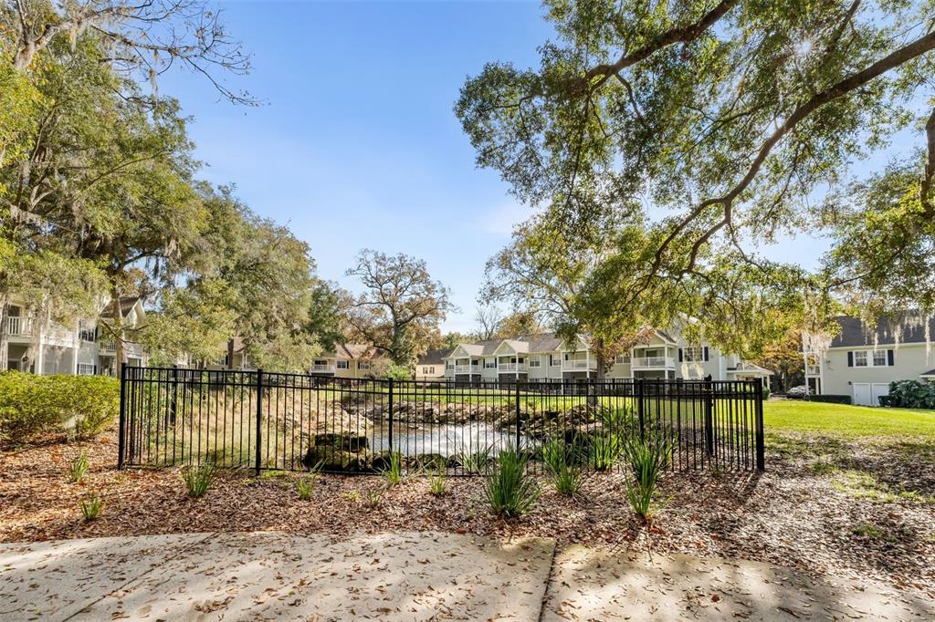 10000 Southwest 52nd Avenue, Unit 35 Gainesville, FL 32608 - Photo 26 of 36 a view of a lake with a house in the background