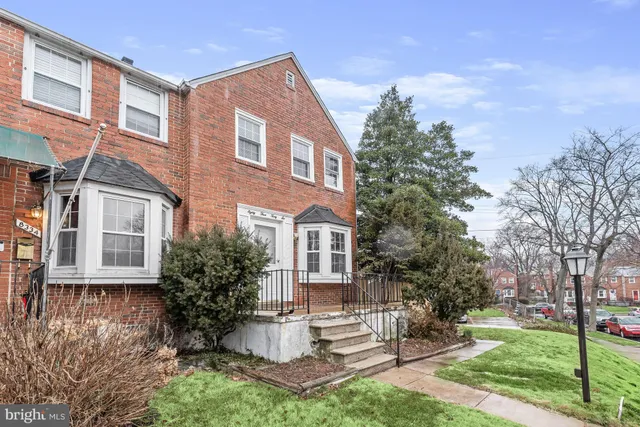 a view of house with yard and green space