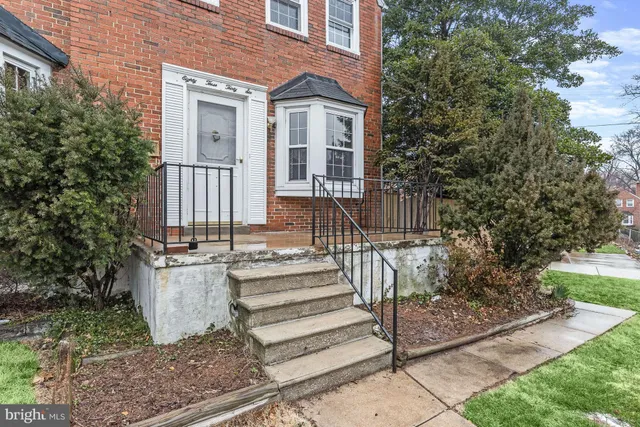 a front view of a house with a porch