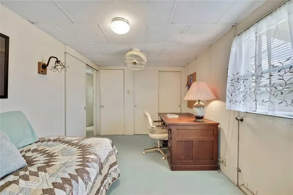 a bedroom with a bed and a table in it