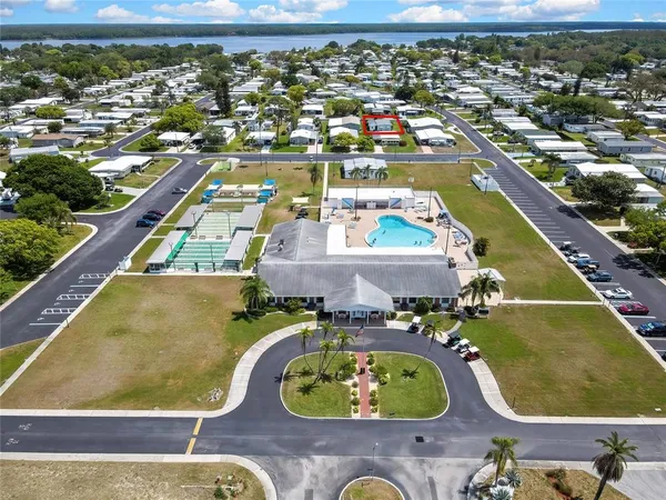 an aerial view of a pool patio yard and outdoor seating
