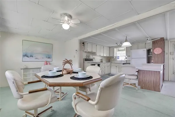 a view of a dining room with furniture