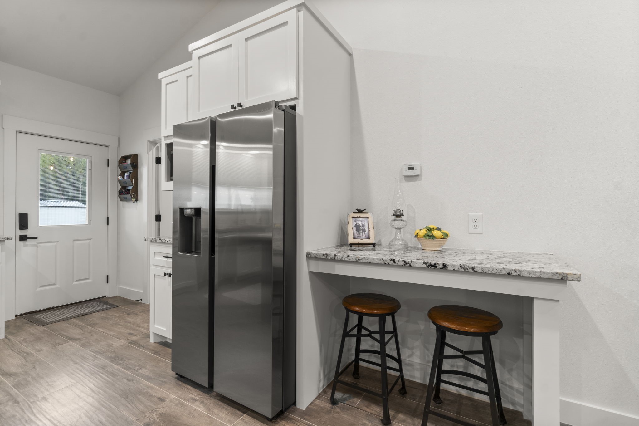 15651 Ben Wiggins Road Conroe, TX 77303 - Photo 15 of 47 a kitchen with stainless steel appliances granite countertop a refrigerator and a stove top oven