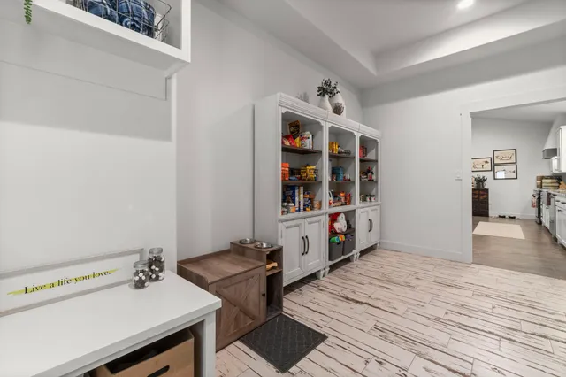 a hallway with a wooden floor and breakfast area