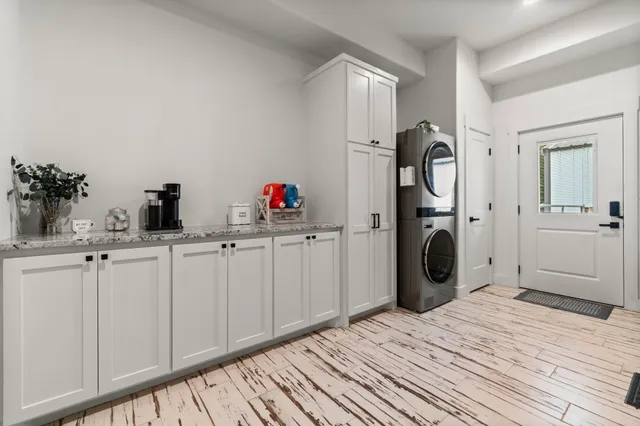 a kitchen with a sink and a refrigerator