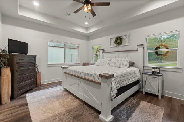 a bedroom with a bed and a television