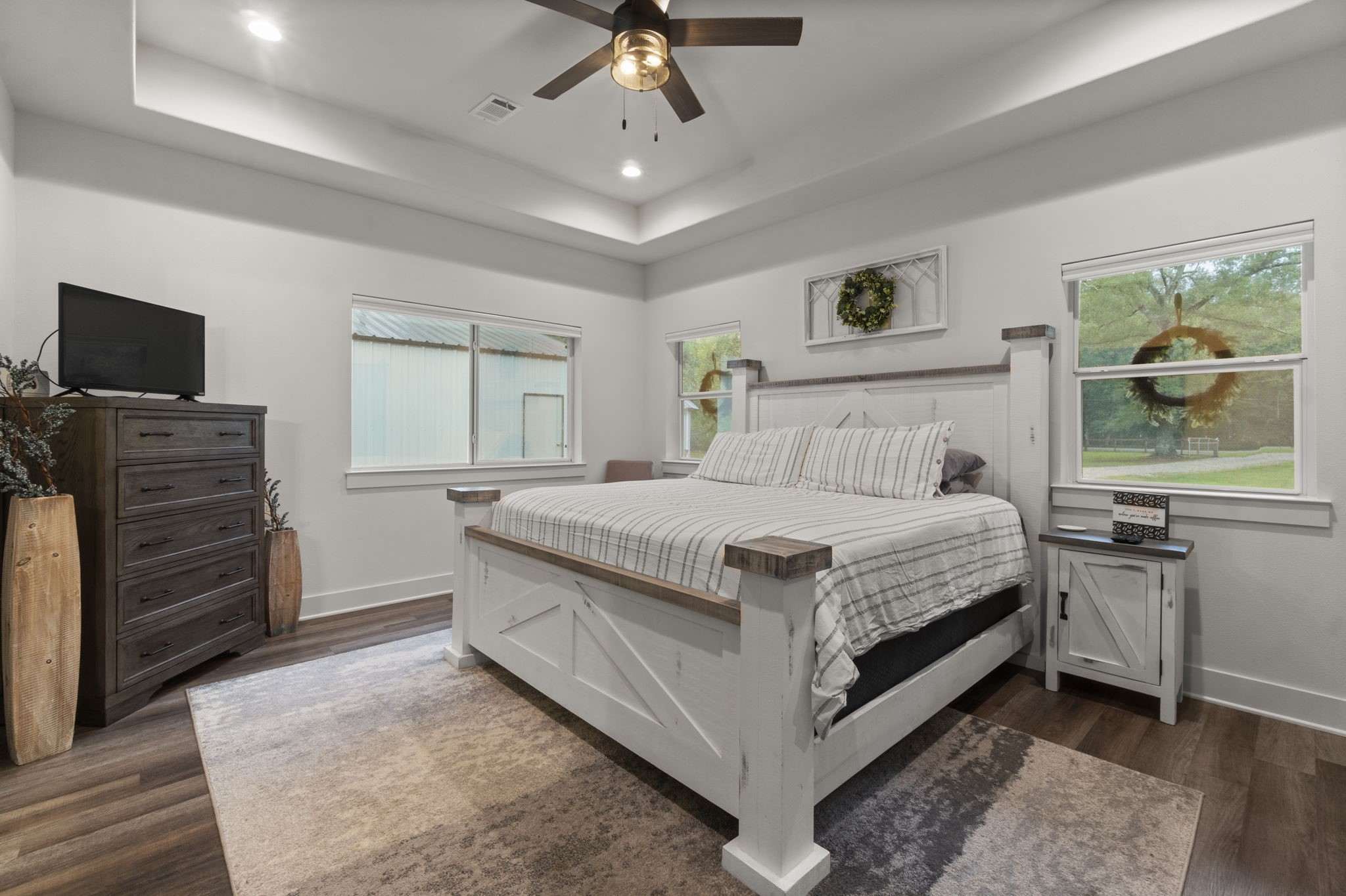 15651 Ben Wiggins Road Conroe, TX 77303 - Photo 19 of 47 a bedroom with a bed and a television