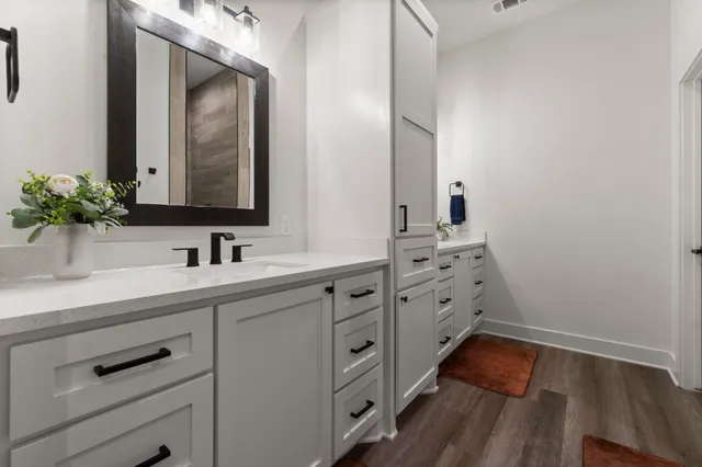 a bathroom with a sink and a mirror
