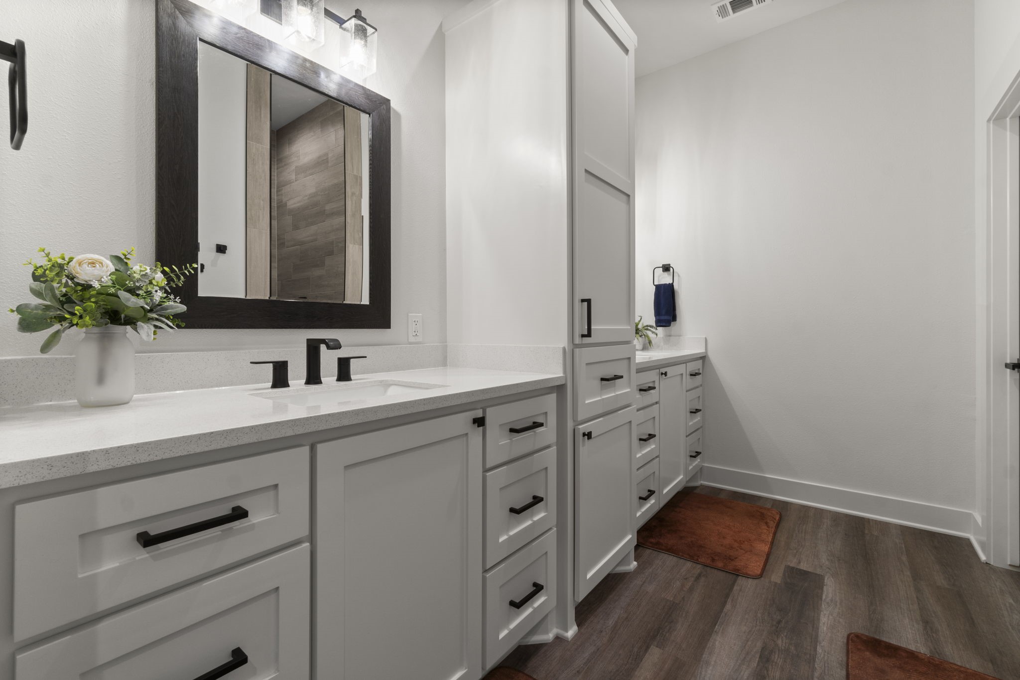 15651 Ben Wiggins Road Conroe, TX 77303 - Photo 22 of 47 a bathroom with a sink and a mirror