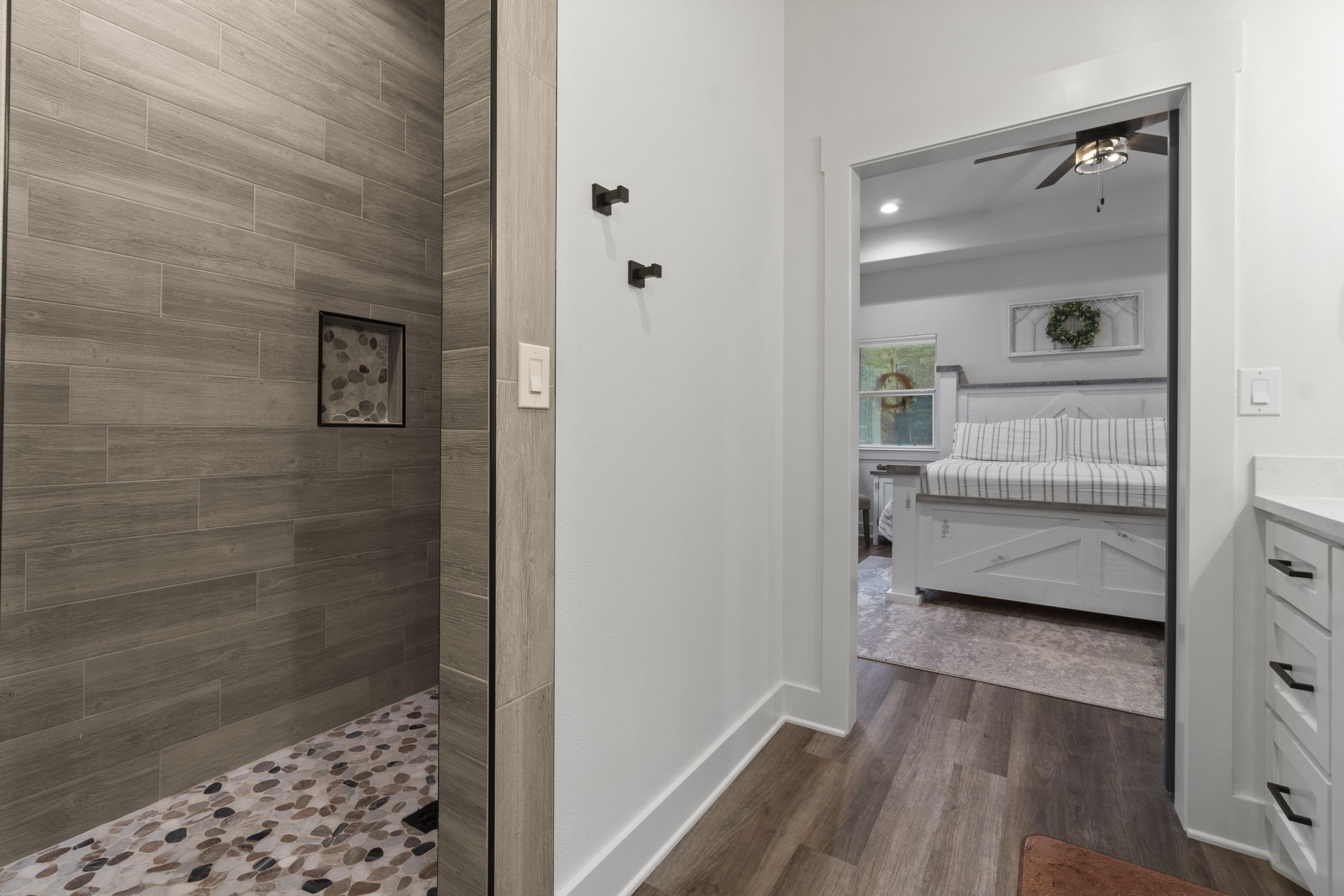 15651 Ben Wiggins Road Conroe, TX 77303 - Photo 24 of 47 a bathroom with a glass door shower