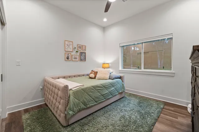 a bedroom with a bed and window