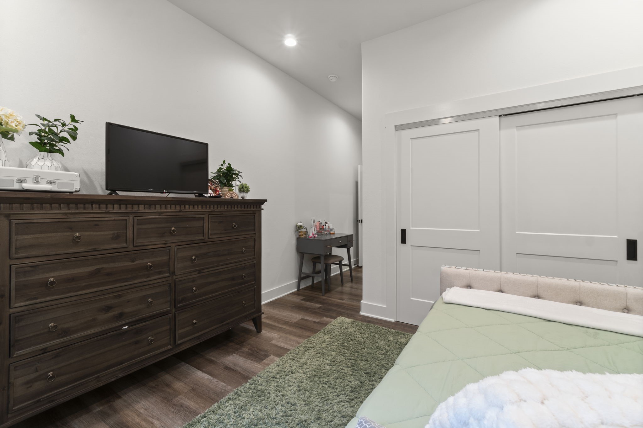 15651 Ben Wiggins Road Conroe, TX 77303 - Photo 35 of 47 a living room with furniture and a flat screen tv