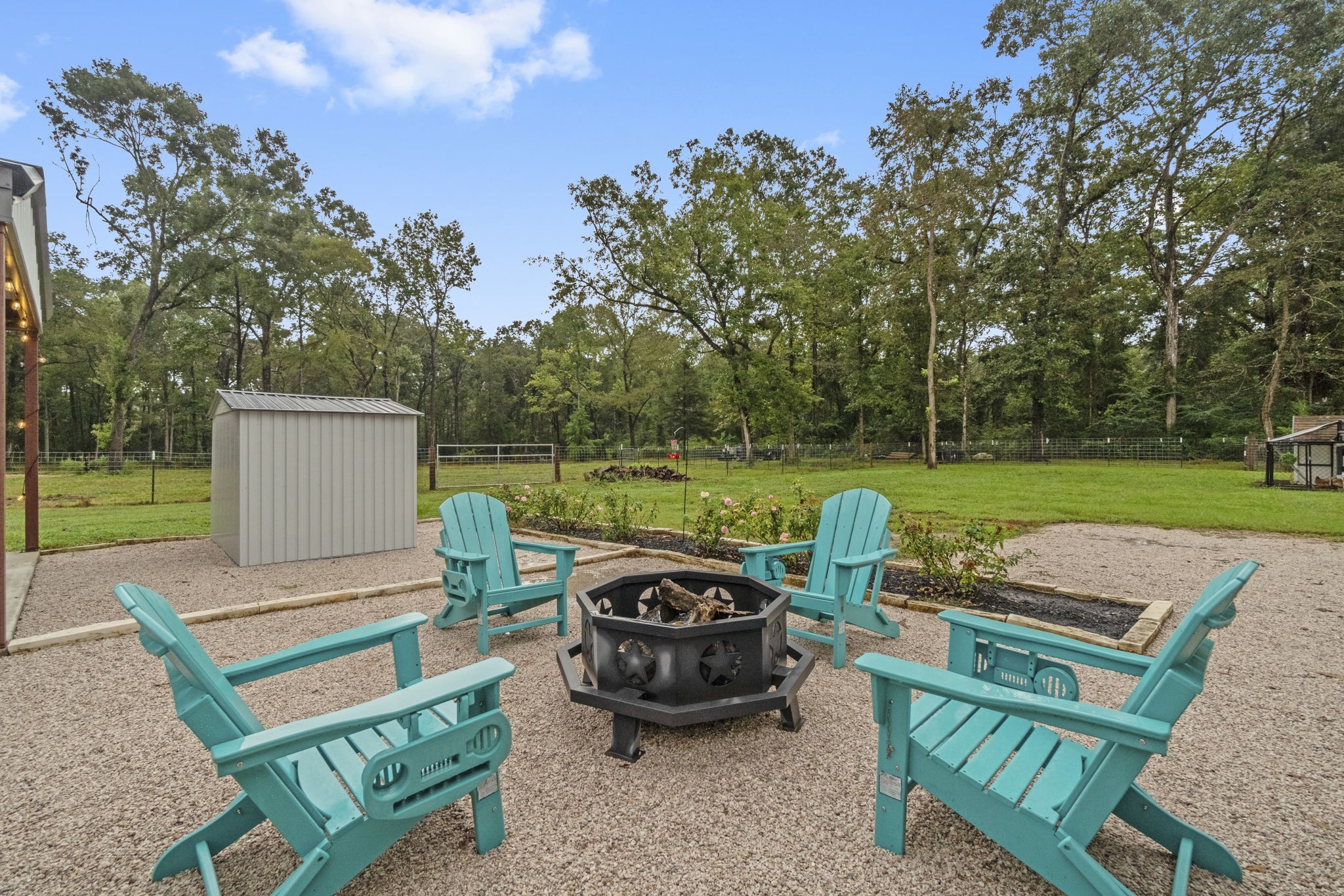 15651 Ben Wiggins Road Conroe, TX 77303 - Photo 40 of 47 a view of a backyard with sitting area