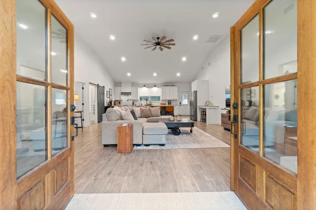 a living room with furniture and a large window