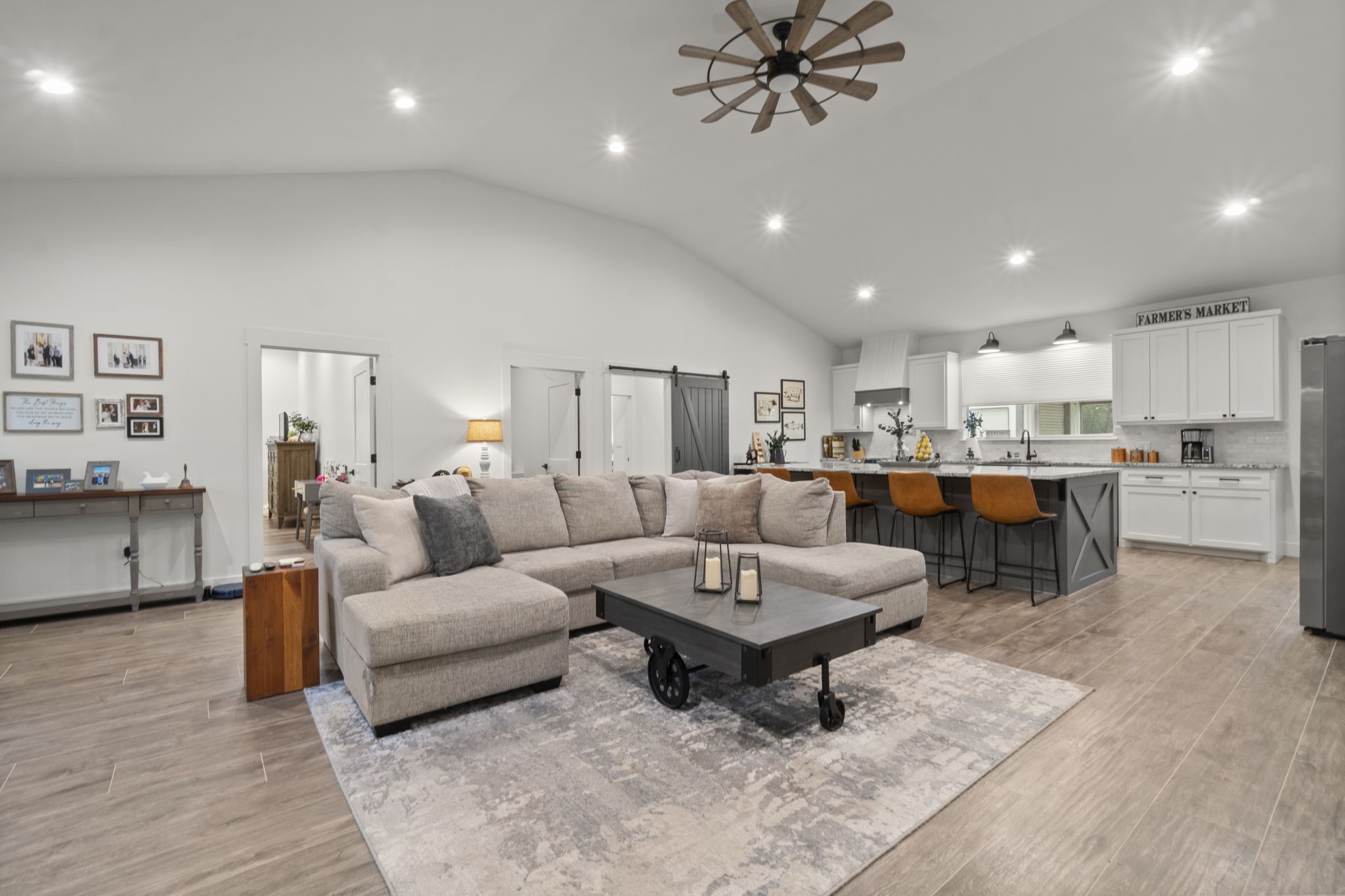 15651 Ben Wiggins Road Conroe, TX 77303 - Photo 7 of 47 a living room with lots of furniture and kitchen view