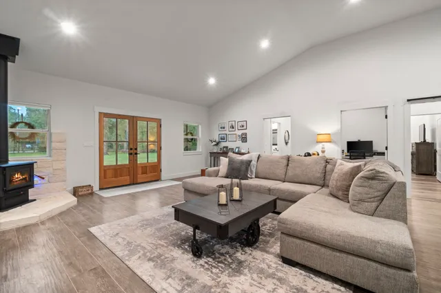 a living room with furniture and a table