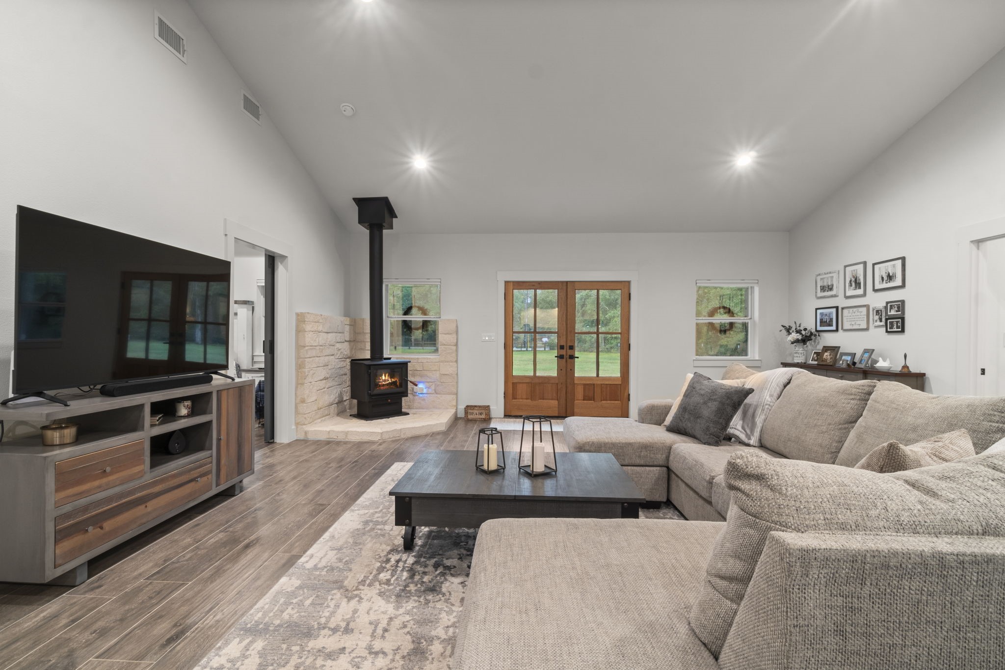 15651 Ben Wiggins Road Conroe, TX 77303 - Photo 9 of 47 a living room with furniture and a flat screen tv