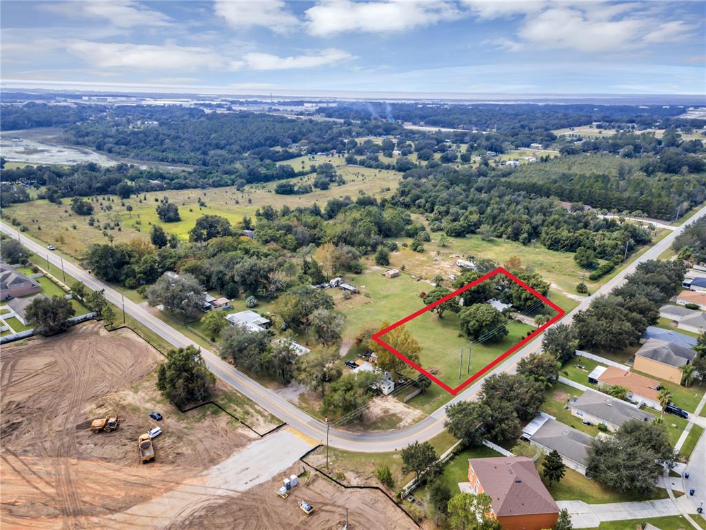 2502 Schopke Road Apopka, FL 32712 - Photo 1 of 3 an aerial view of residential houses with outdoor space