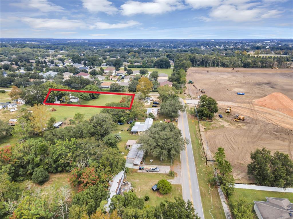 2502 Schopke Road Apopka, FL 32712 - Photo 2 of 3 an aerial view of residential houses with outdoor space