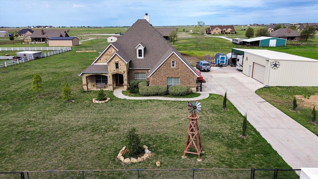 119 George Owens Road Ponder, TX 76259 - Photo 24 of 26 Brick and stone exterior featuring a covered front porch and dormer window