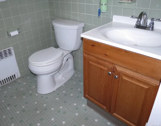 an empty room with closet and a window