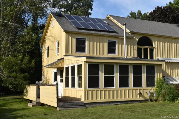 a view of outdoor space with deck and yard