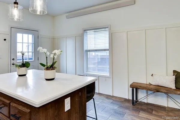 a view of a dining room with furniture and wooden floor