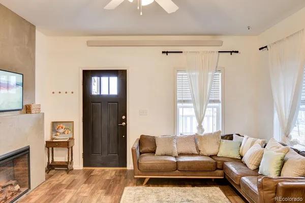 a living room with furniture and a window