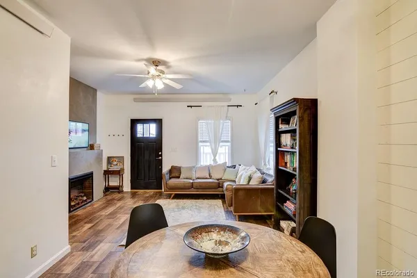 a living room with furniture and a chandelier