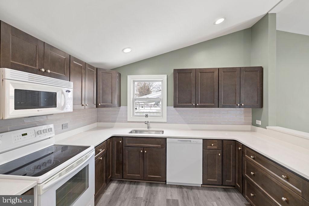 1806 Filbert Street York, PA 17404 - Photo 15 of 33 a kitchen with a sink stove top oven and microwave