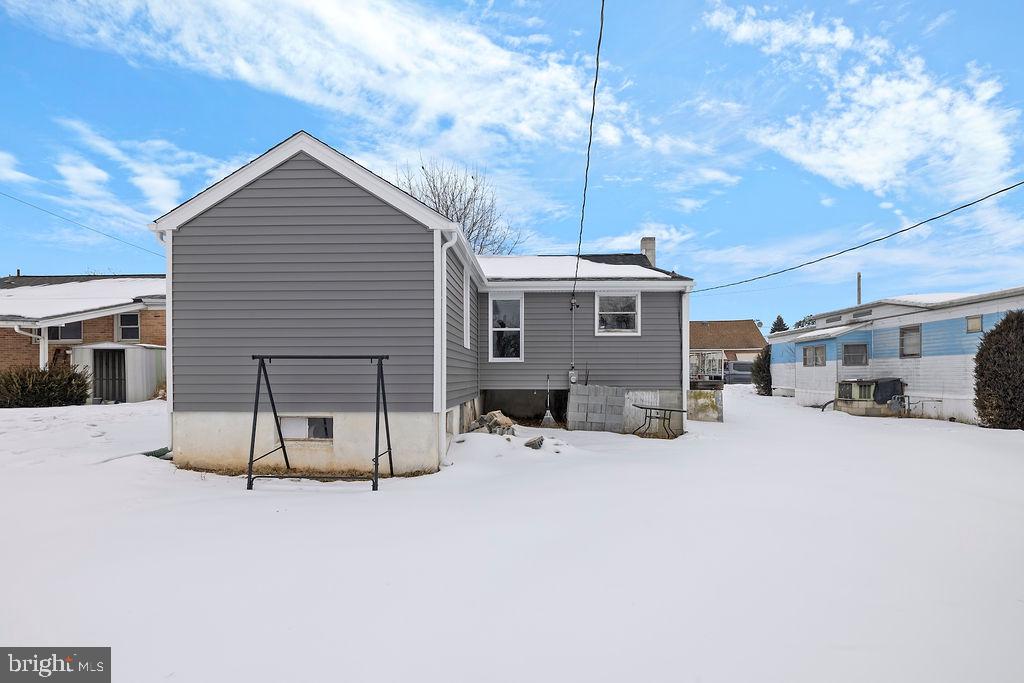 1806 Filbert Street York, PA 17404 - Photo 8 of 33 a view of a house with a yard covered in snow