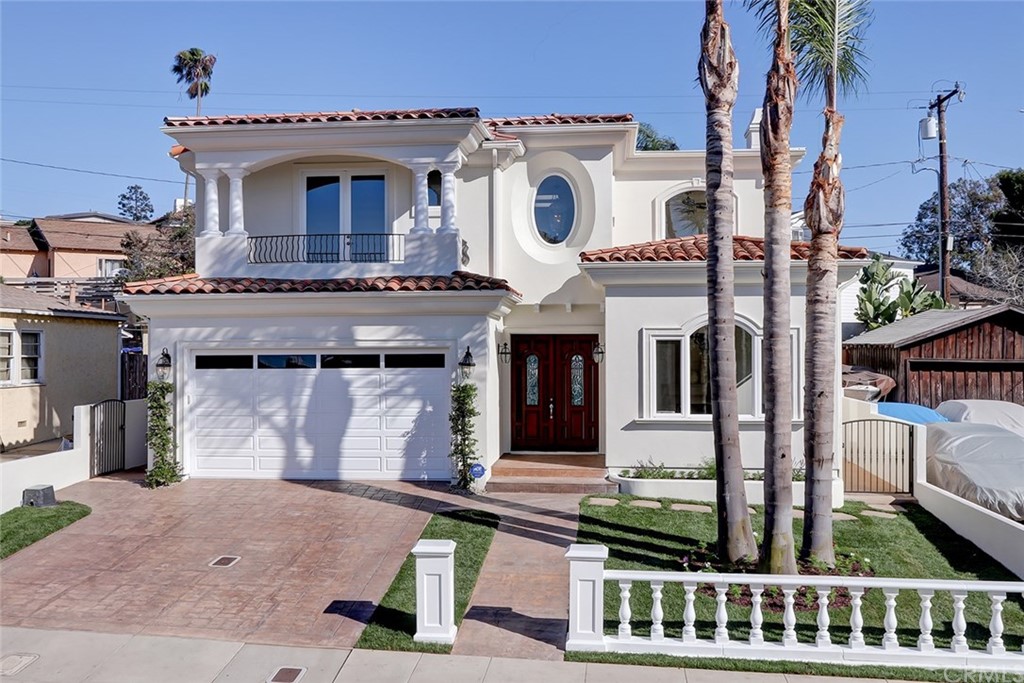 a front view of a house with large windows