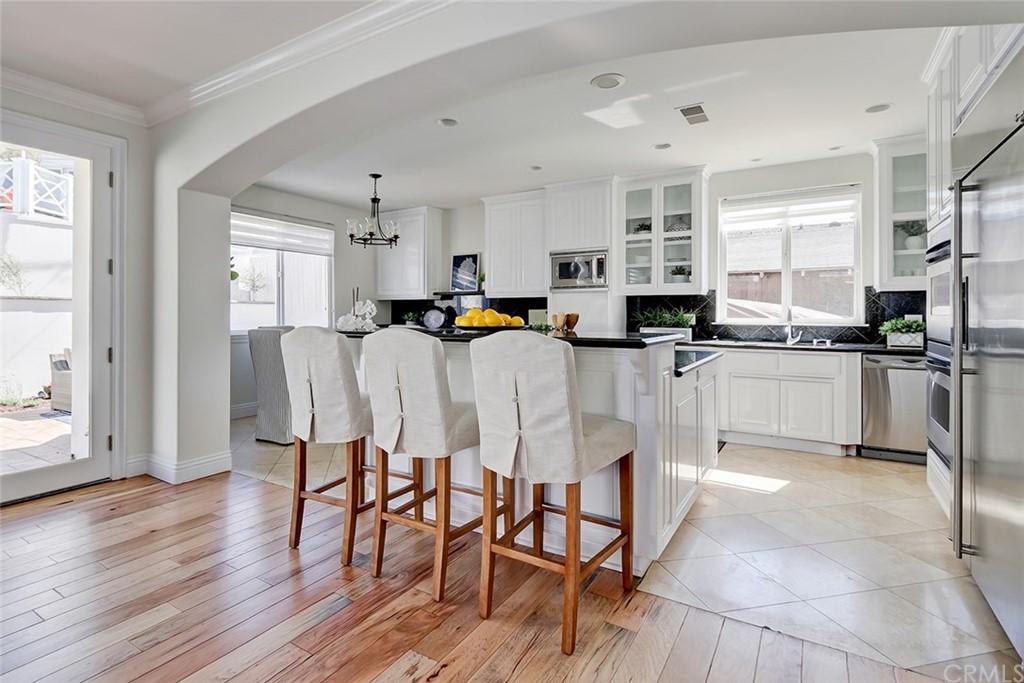 2818 North Ardmore Avenue Manhattan Beach, CA 90266 - Photo 14 of 34 a kitchen with stainless steel appliances a microwave a stove a table and chairs