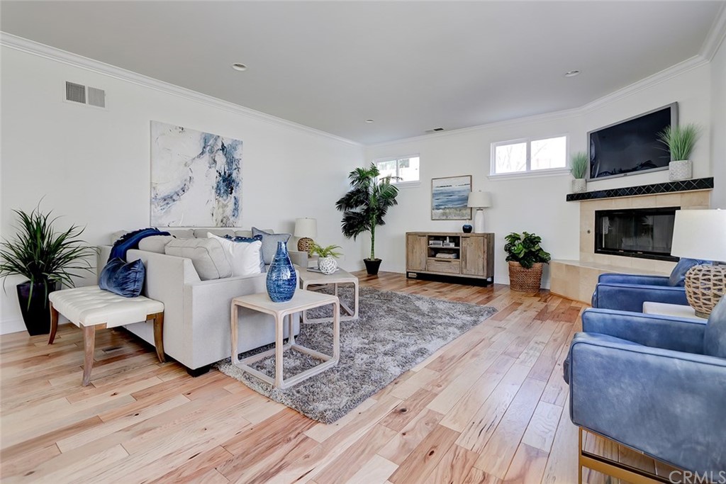 2818 North Ardmore Avenue Manhattan Beach, CA 90266 - Photo 18 of 34 a living room with furniture a fireplace and a flat screen tv