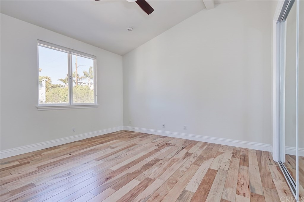 2818 North Ardmore Avenue Manhattan Beach, CA 90266 - Photo 30 of 34 a view of an empty room with wooden floor and a window