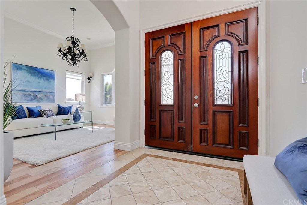 2818 North Ardmore Avenue Manhattan Beach, CA 90266 - Photo 3 of 34 a living room with furniture a chandelier and a window