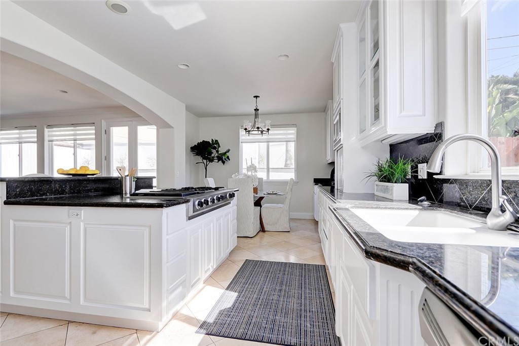 2818 North Ardmore Avenue Manhattan Beach, CA 90266 - Photo 10 of 34 a kitchen with stainless steel appliances granite countertop a sink stove and cabinets