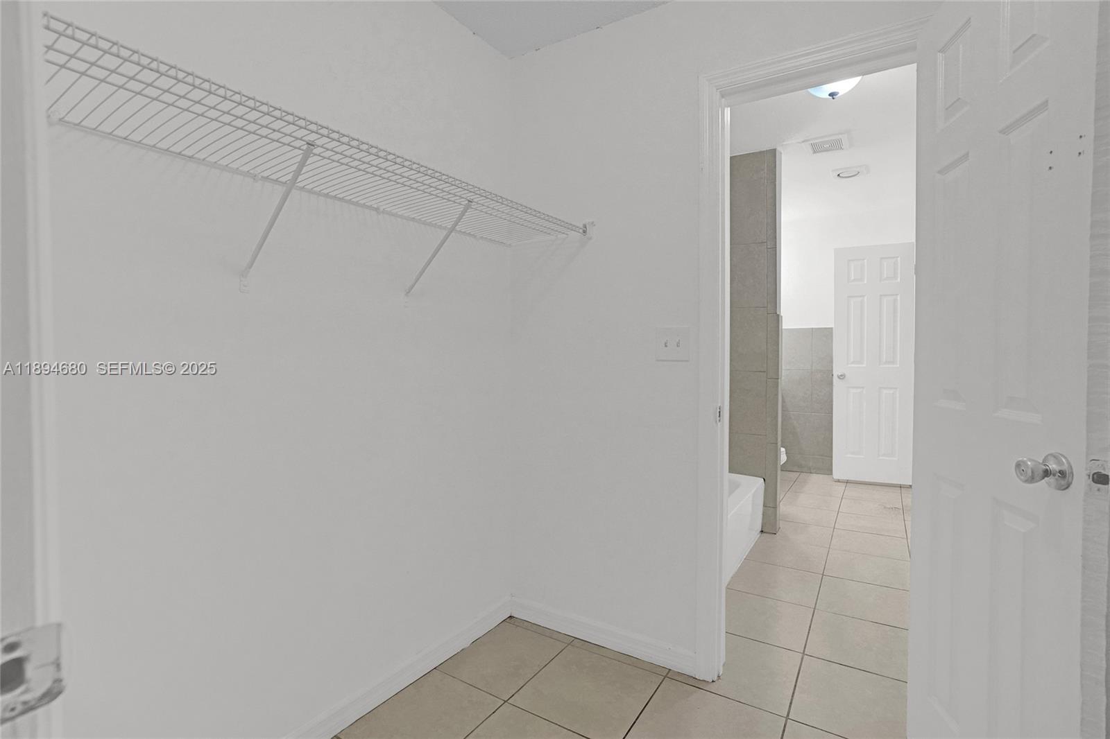 3876 Northwest 207 St Road Miami Gardens, FL 33055 - Photo 17 of 37 a bathroom with a shower