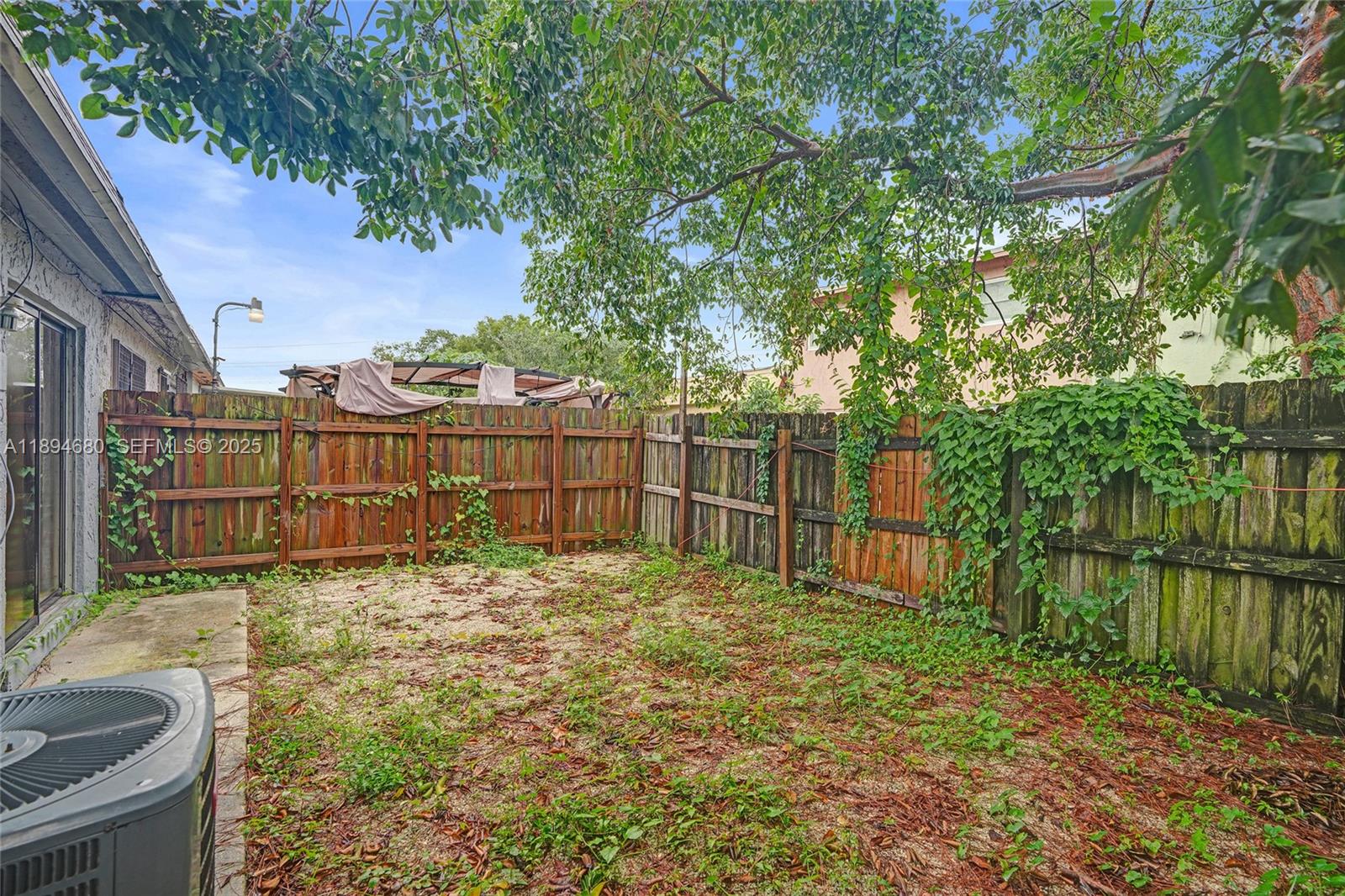 3876 Northwest 207 St Road Miami Gardens, FL 33055 - Photo 31 of 37 a view of a backyard